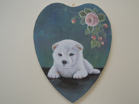 ペットロスの方がペットのリアルな似顔絵の注文（オーダー）前に見る作品～薔薇の花のそばで横たわる仔犬を立体感を出して描いた肖像画のグッズ